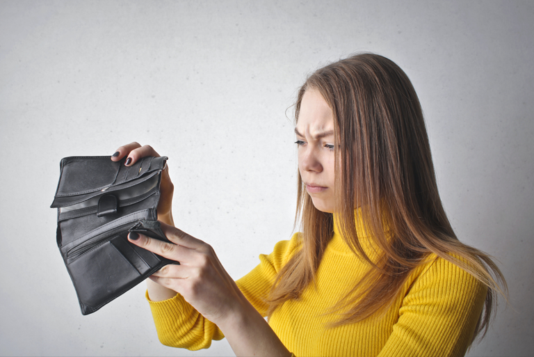 woman holding black wallet
